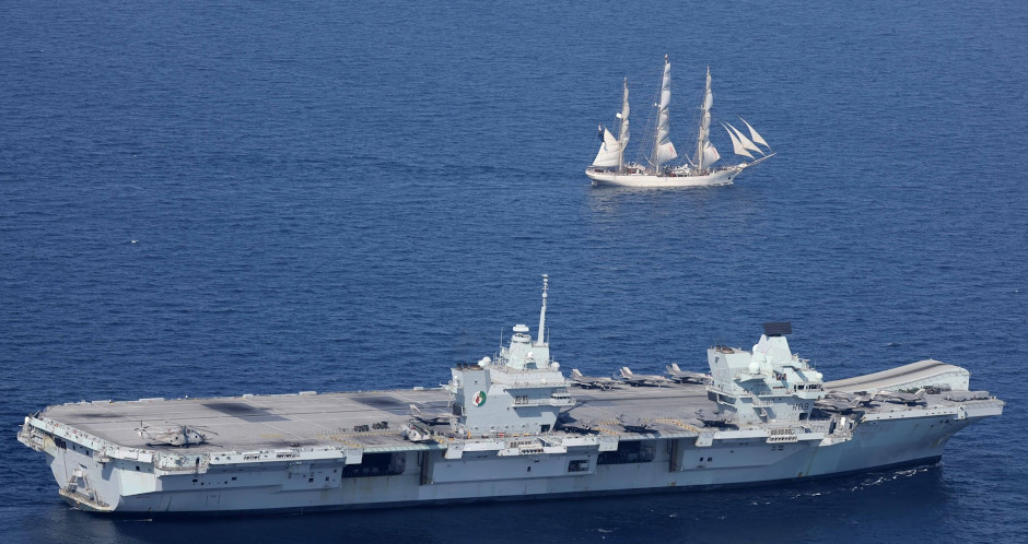 HMS Queen Elizabeth with Omani sailing ship